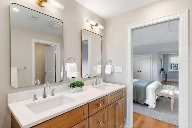 162 Swanton St Unit 162, Winchester, MA 01890 - ensuite bathroom featuring double vanity and wood finished floors