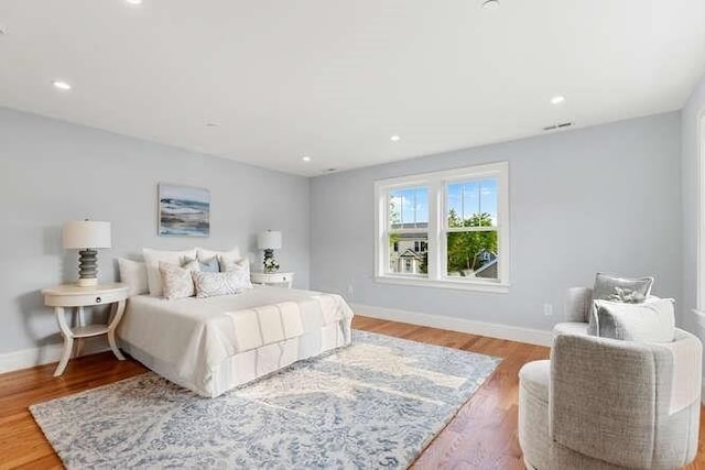 162 Swanton St Unit 162, Winchester, MA 01890 - bedroom with baseboards, light wood-style floors, and recessed lighting