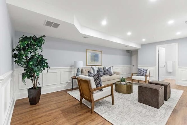162 Swanton St Unit 162, Winchester, MA 01890 - living room featuring a wainscoted wall, a decorative wall, recessed lighting, and light wood-style flooring