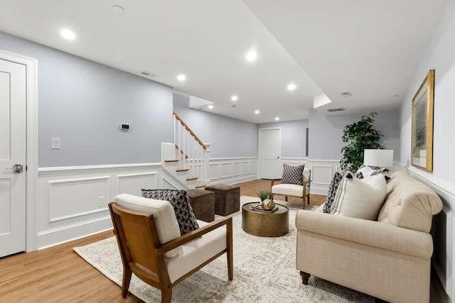 162 Swanton St Unit 162, Winchester, MA 01890 - living area featuring a decorative wall, wainscoting, stairs, wood finished floors, and recessed lighting