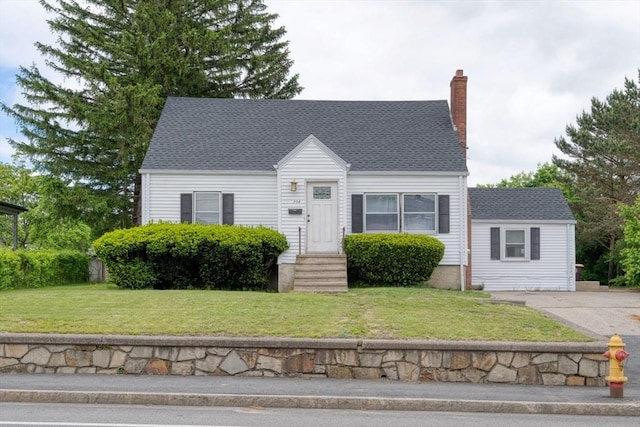 208 Green St, Weymouth, MA 02191 - new england style home featuring a front lawn and a chimney