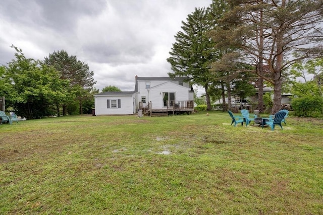 208 Green St, Weymouth, MA 02191 - view of green lawn with a wooden deck and an outdoor fire pit