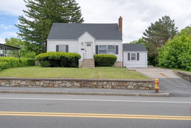 208 Green St, Weymouth, MA 02191 - new england style home with asphalt driveway, a chimney, and a front lawn