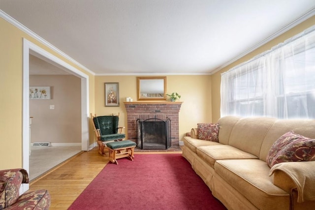 208 Green St, Weymouth, MA 02191 - living room featuring ornamental molding, wood finished floors, a brick fireplace, and baseboards