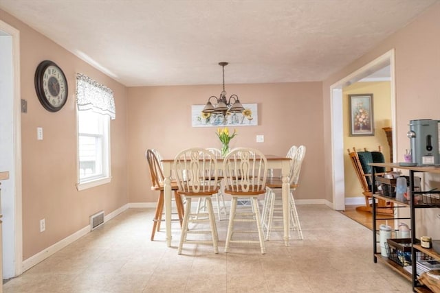 208 Green St, Weymouth, MA 02191 - dining area featuring a chandelier and baseboards