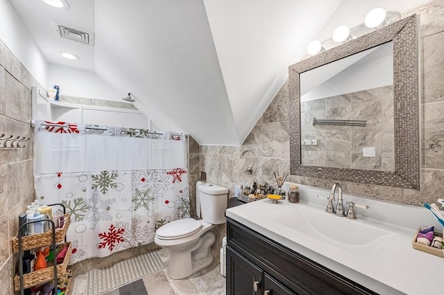 70 Riverdale St, West Springfield, MA 01089 - bathroom featuring tile walls, toilet, vanity, vaulted ceiling, and curtained shower