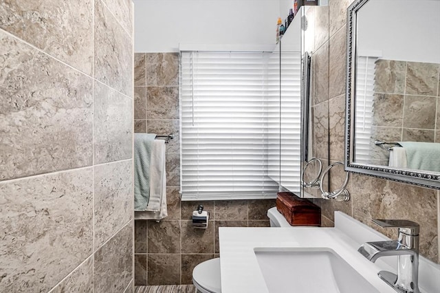 70 Riverdale St, West Springfield, MA 01089 - bathroom with tile walls, toilet, and vanity