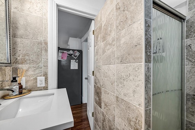 70 Riverdale St, West Springfield, MA 01089 - full bathroom with tile walls, vanity, wood finished floors, and a shower