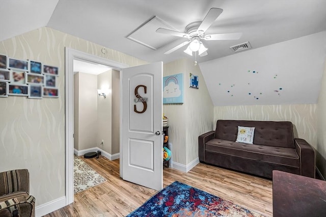 70 Riverdale St, West Springfield, MA 01089 - living area with wood finished floors, vaulted ceiling, a ceiling fan, and attic access