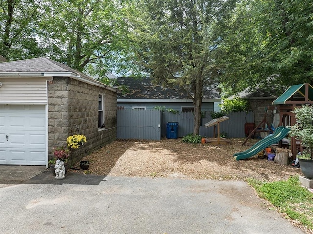 70 Riverdale St, West Springfield, MA 01089 - view of yard with a playground, a garage, and driveway