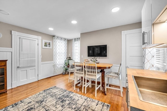 70 Riverdale St, West Springfield, MA 01089 - dining area with a wainscoted wall, light wood-style flooring, and recessed lighting