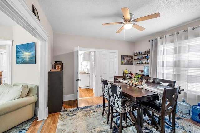 70 Riverdale St, West Springfield, MA 01089 - dining room featuring a ceiling fan, light wood-type flooring, and a textured ceiling