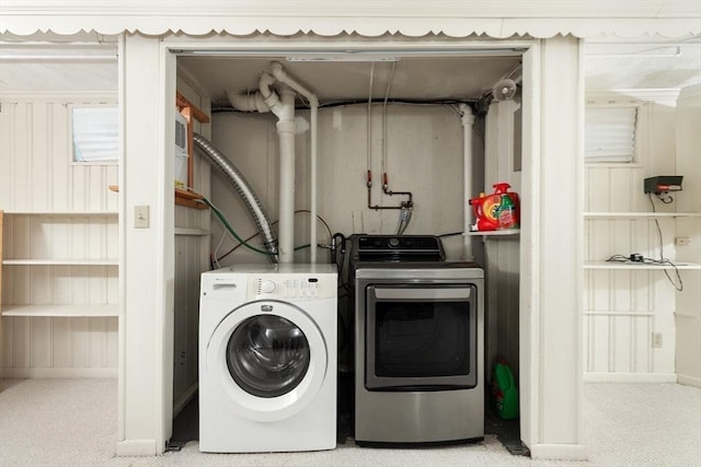 laundry area featuring carpet floors and washing machine and clothes dryer