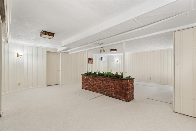 interior space with carpet and visible vents