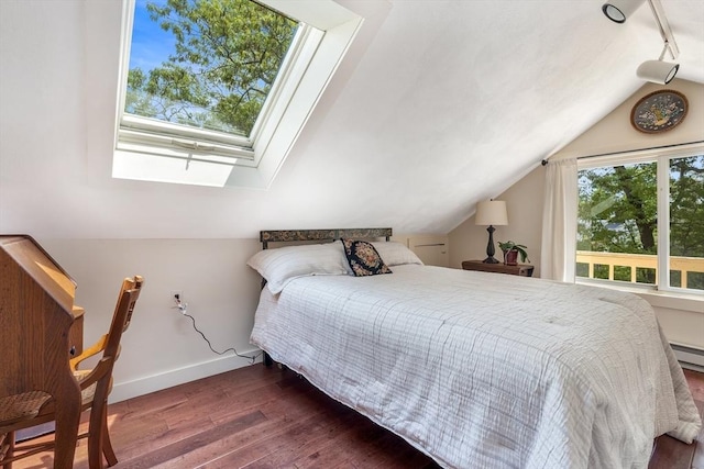 bedroom with wood-type flooring, baseboards, lofted ceiling, a skylight, and rail lighting