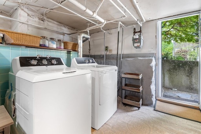 laundry area featuring washing machine and clothes dryer
