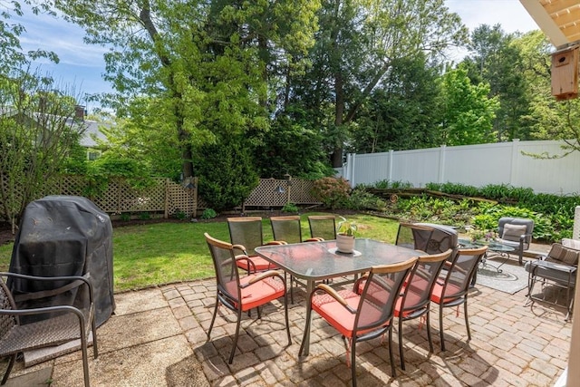 view of patio with outdoor dining space and area for grilling