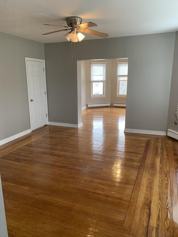 58 Ames Ave, Chicopee, MA 01013 - unfurnished room featuring ceiling fan, wood finished floors, baseboards, and a baseboard heating unit