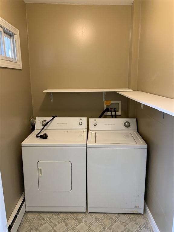 58 Ames Ave, Chicopee, MA 01013 - laundry room with a baseboard radiator, washer and dryer, baseboards, and light floors