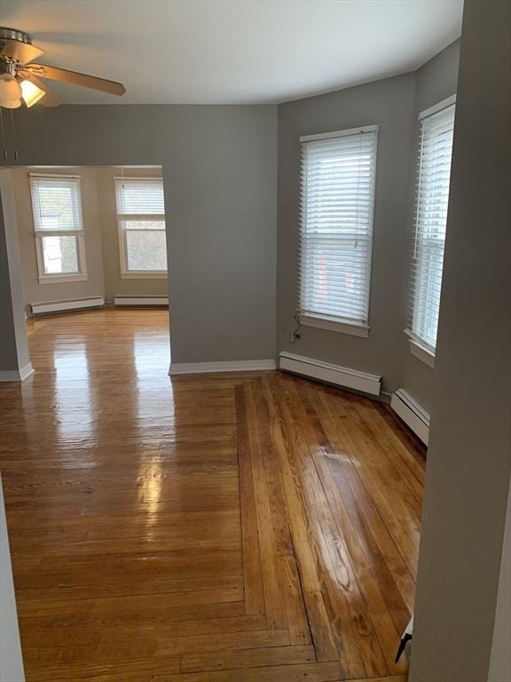 58 Ames Ave, Chicopee, MA 01013 - unfurnished room with baseboard heating, a ceiling fan, a baseboard heating unit, and baseboards