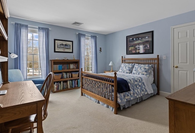 bedroom featuring light colored carpet