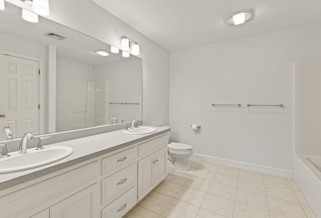 bathroom featuring vanity, tile patterned floors, and toilet