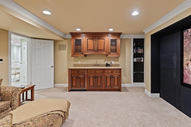 bar featuring sink, light colored carpet, and crown molding