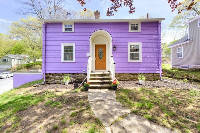 197 Eastern Ave, Worcester, MA 01605 - view of front of home featuring a chimney and entry steps
