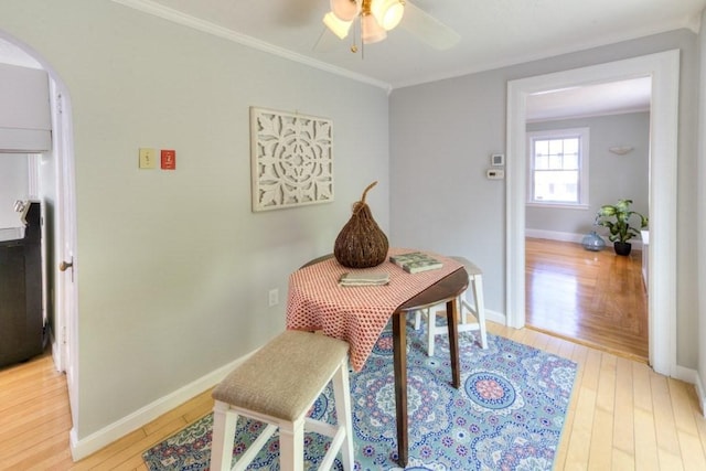 197 Eastern Ave, Worcester, MA 01605 - dining area with light wood-style floors, ceiling fan, arched walkways, ornamental molding, and baseboards