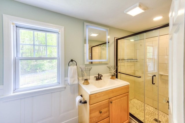 197 Eastern Ave, Worcester, MA 01605 - bathroom with a shower stall, vanity, wainscoting, and a decorative wall