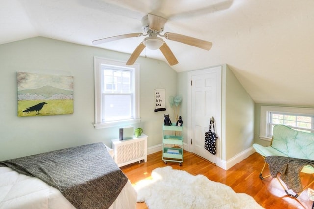 197 Eastern Ave, Worcester, MA 01605 - bedroom with lofted ceiling, wood finished floors, ceiling fan, radiator, and baseboards