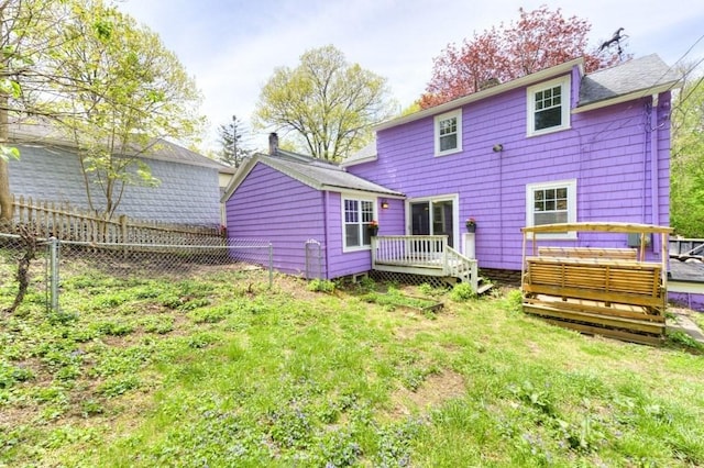 197 Eastern Ave, Worcester, MA 01605 - back of property with fence and a wooden deck