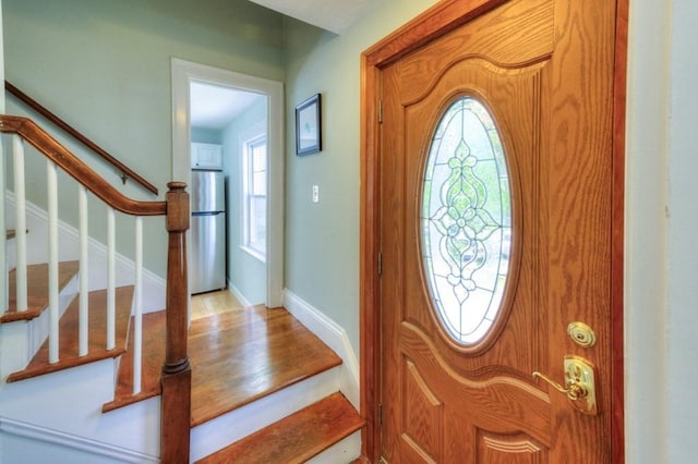 197 Eastern Ave, Worcester, MA 01605 - entrance foyer with stairway, wood finished floors, and baseboards