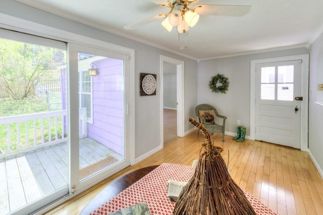 197 Eastern Ave, Worcester, MA 01605 - doorway with wood-type flooring, ornamental molding, baseboards, and ceiling fan