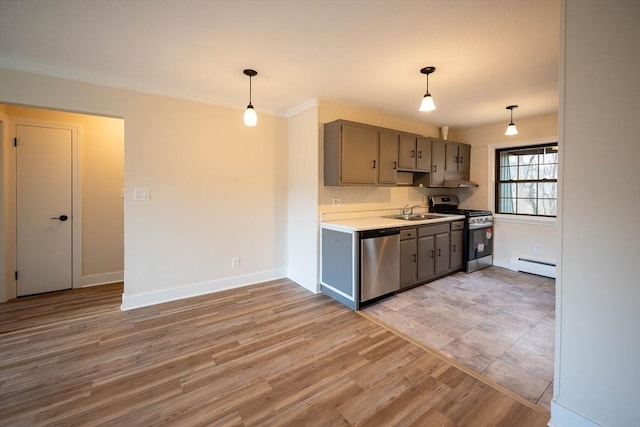 kitchen featuring decorative light fixtures, light hardwood / wood-style floors, stainless steel appliances, and a baseboard radiator