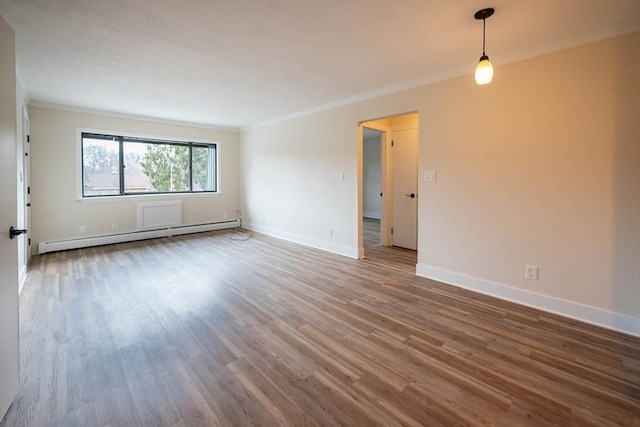 unfurnished room featuring a baseboard radiator, dark hardwood / wood-style flooring, and ornamental molding