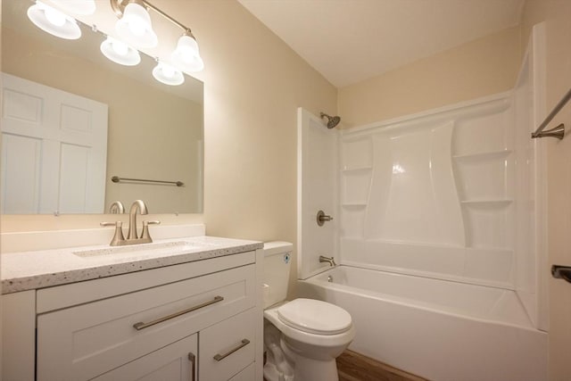 full bathroom with toilet, vanity, shower / tub combination, and hardwood / wood-style flooring