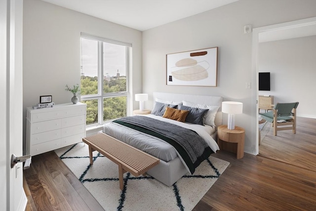 bedroom with wood finished floors