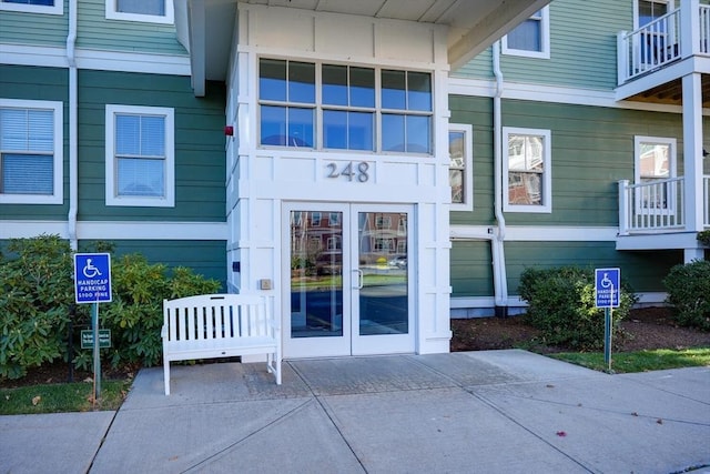 view of exterior entry featuring french doors