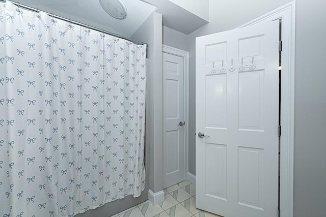 32 Eaton Rd W, Framingham, MA 01701 - bathroom featuring curtained shower and baseboards