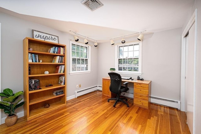 32 Eaton Rd W, Framingham, MA 01701 - office space featuring track lighting, baseboard heating, and light wood-style flooring
