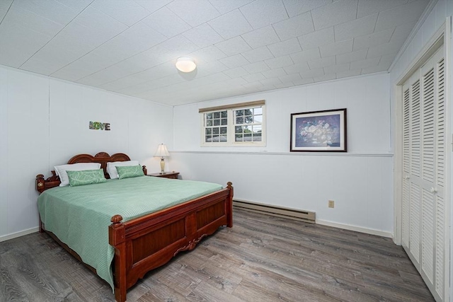 32 Eaton Rd W, Framingham, MA 01701 - bedroom with a baseboard heating unit, wood finished floors, and a closet