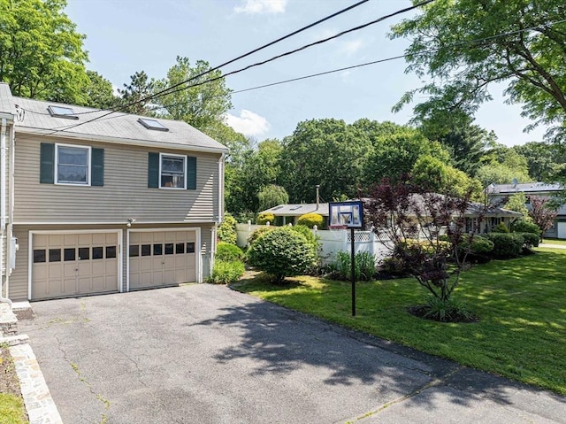 32 Eaton Rd W, Framingham, MA 01701 - view of side of property featuring driveway, an attached garage, and a lawn