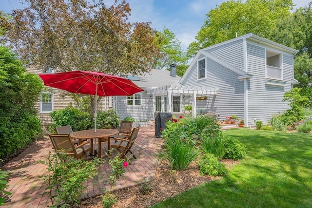 5 Putnam Ave, Barnstable, MA 02635 - view of green lawn with a pergola, a patio area, and outdoor dining area
