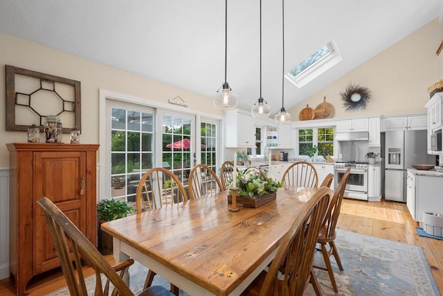5 Putnam Ave, Barnstable, MA 02635 - dining space featuring a skylight, light wood-style flooring, high vaulted ceiling, and healthy amount of natural light