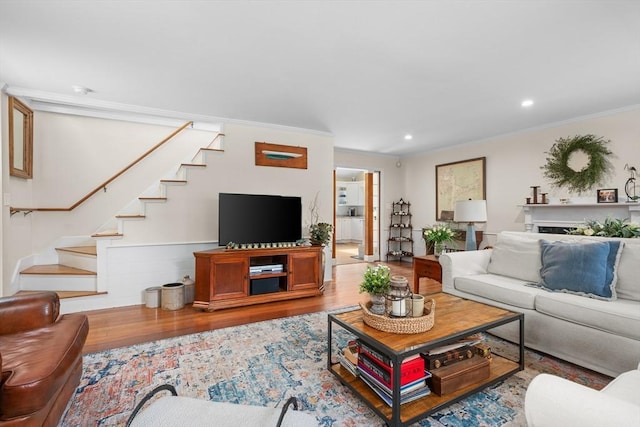 5 Putnam Ave, Barnstable, MA 02635 - living room featuring stairway, wood finished floors, ornamental molding, and recessed lighting