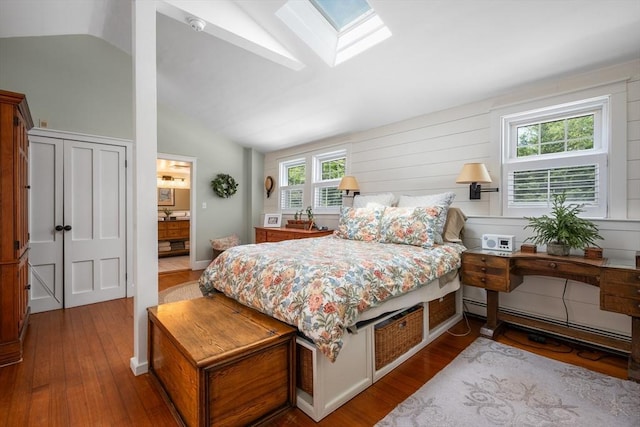 5 Putnam Ave, Barnstable, MA 02635 - bedroom with a baseboard radiator, vaulted ceiling, wood finished floors, a skylight, and ensuite bathroom