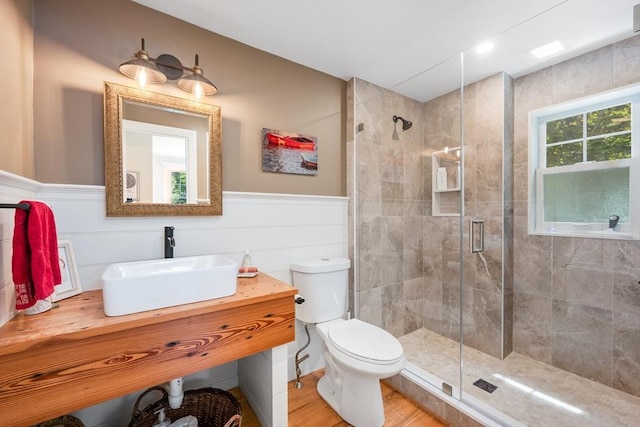 5 Putnam Ave, Barnstable, MA 02635 - bathroom with a stall shower, wainscoting, vanity, and wood finished floors