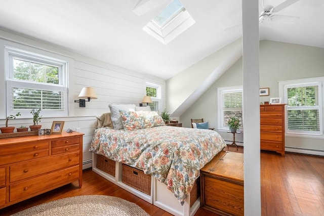 5 Putnam Ave, Barnstable, MA 02635 - bedroom with wood finished floors, multiple windows, baseboard heating, and vaulted ceiling