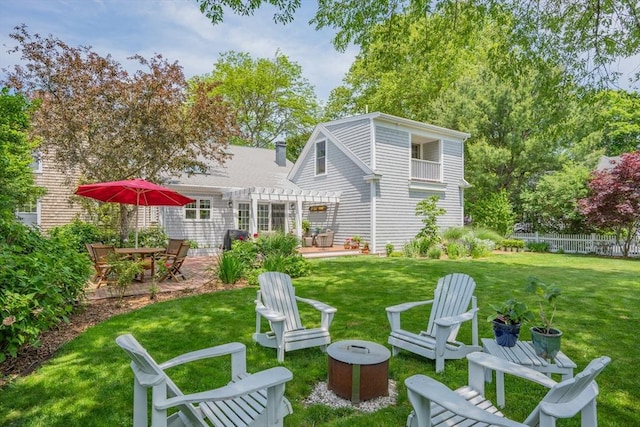 5 Putnam Ave, Barnstable, MA 02635 - rear view of house featuring a pergola, an outdoor fire pit, and a patio